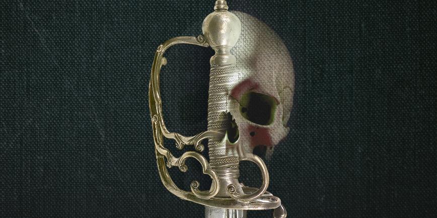 The gold hilt of a sword against a dark fabric background. The outline of a human skull has been digitally superimposed on to the right side of the hilt, creating an unsettling central motif 